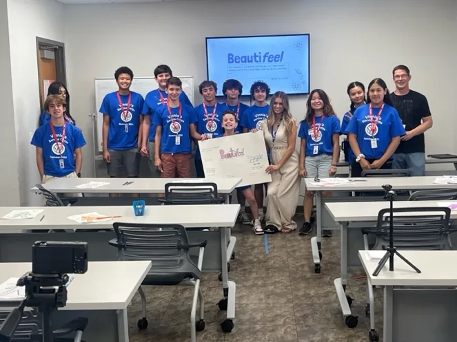 Lindsey Wawrzyniak with youth after a Beautifeel presentation